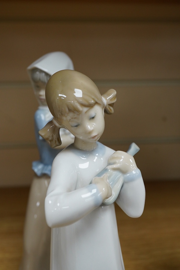 A Royal Doulton Images group and four LLadro figures